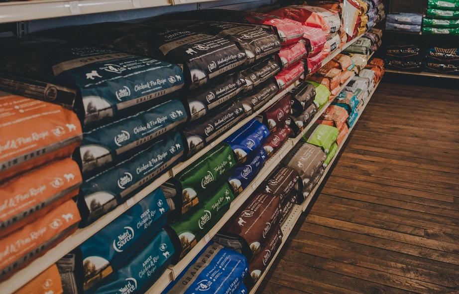 A colorful array of pet food on a store shelf